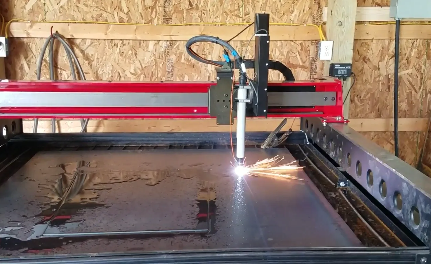 Cutting Edge Design specializes in plasma cutting, here a table cuts metal.