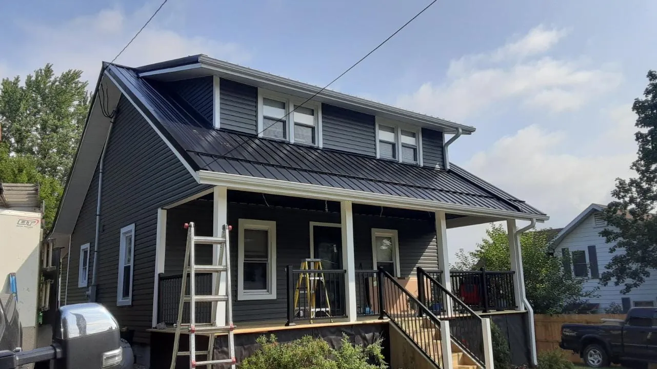 Little John's Construction in Carrollton, Ohio works on a residential roofing and siding project.